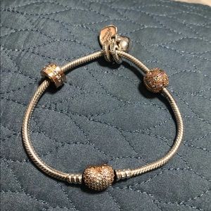 Pandora Heart clasp bracelet with charms.